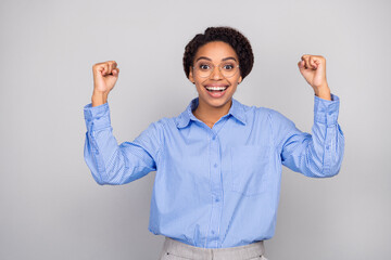 Photo portrait of pretty young bussinesswoman winning raise fists wear trendy formalwear isolated...