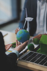 Green energy business company meeting with business people planning and discuss marketing of sustainable and renewable clean energy product with solar cell and wind turbine generator. Trailblazing