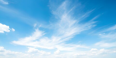 Clear Blue Sky with Wispy Clouds – A Bright and Airy View