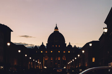 Obraz premium Beautiful silhouette night view of St Peter's Basilica in Vatican City. Architecture, landmark and attractions of Rome, Italy. High quality photo