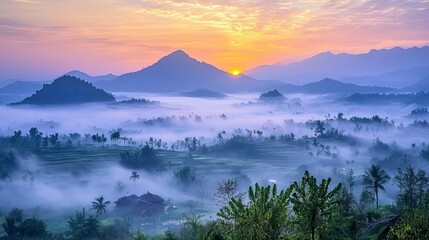 Beautiful sunrise at misty morning mountains