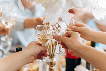 bride and groom holding champagne glasses