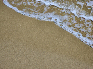 Sea background. Soft wave of blue sea on sandy beach