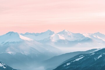 View of the mountain range with snow on top, soft pink sky.