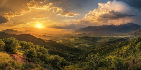 A breathtaking panoramic perspective highlights the splendor of mountains and valleys, adorned with drifting clouds and a stunning sunset illuminating the scene.