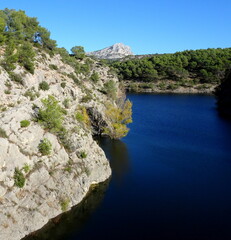 Sainte Victoire mountain near Aix en Provence seen from the lake of Zola Dam, France. mediterranean...