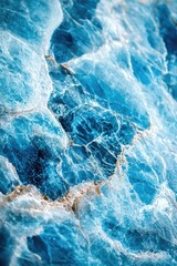Obraz premium A close-up view of the ocean's surface showing gentle waves and blue water