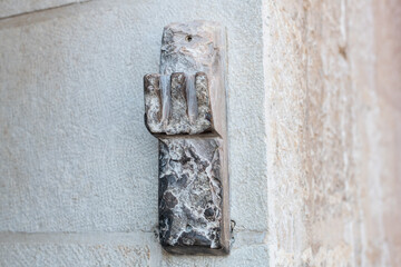 A mezuzah made from stone affixed to the outside entrance to a home in Jerusalem.