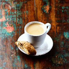 Cup of coffee and Cantuccini (Italian cookie) on dark wooden background. Copy space.