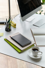 modern workspace with notebooks and stationery
