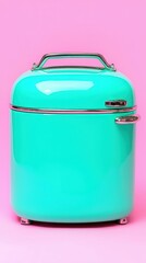 Obraz premium Turquoise Retro Refrigerator on Pink Background Kitchen Appliance Home Decor Vintage S
