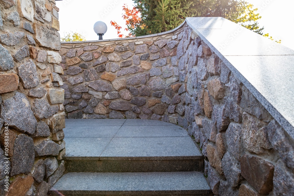 Wall mural stone staircase with curved rock wall in outdoor landscape design