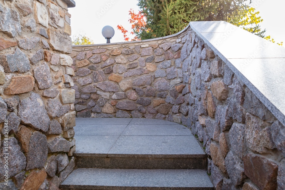 Wall mural stone staircase with curved rock wall in outdoor landscape design