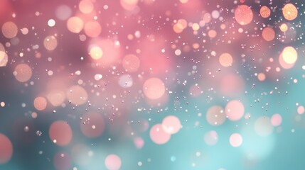 Elegant and trendy mint and pink glitter particles flow underwater with a shallow depth of field creating a shimmering and luxurious festive background filled with sparkles and lights