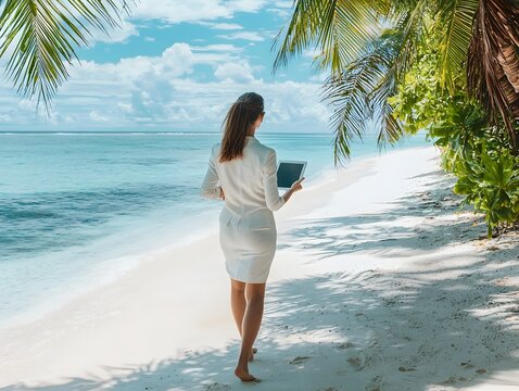 Businesswoman Relaxing and Working on Tropical Beach with Tablet