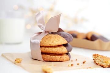 Chip cookies dipped in a chocolate with a bow