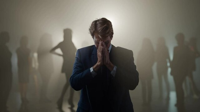 Problems in a relationship, a young man cannot find the only love. A suffering young man and ex-girlfriends in the background in the fog