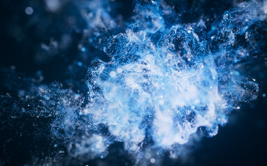 Blue flowing particles with explosive wave effect, 3d rendering.