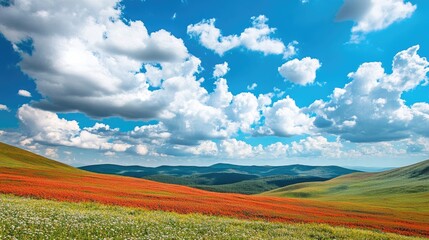 Vibrant red and blue hills create a striking backdrop with fluffy white clouds overhead, offering a stunning landscape scene for creative projects, with ample copy space for text.