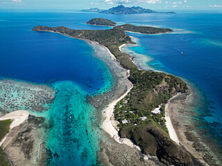 The Yasawa Islands in Fiji are known for stunning beaches, crystal-clear waters, and lush landscapes, offering activities like snorkeling, diving, and island hopping.        © Travel Tips Stories