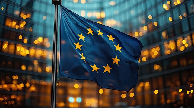The flag of the European Union waving in front of the European Parliament building at night, representing Europe Day celebrations or elections, perfect for posters, banners, or European dreams