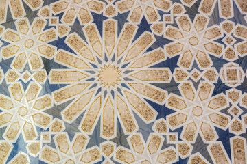 Arabic style, granite and marble floor mosaic with star and floral geometric motifs and patterns in Abu Dhabi, UAE 