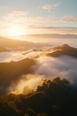Sunset over mountains with low clouds