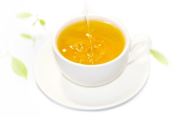 Pouring tea water in cup and serving on white background,isolate pictures.