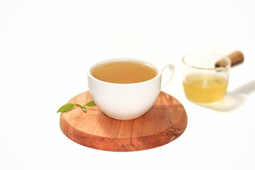 Isolation photos concept with tea water serving on wooden plates in white background.