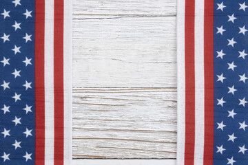 Retro USA red, white and blue stars and stripes banner on wood background