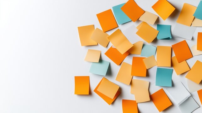 Scattered colorful sticky notes in shades of orange, blue, and yellow on a white background promoting creativity and organization concepts.