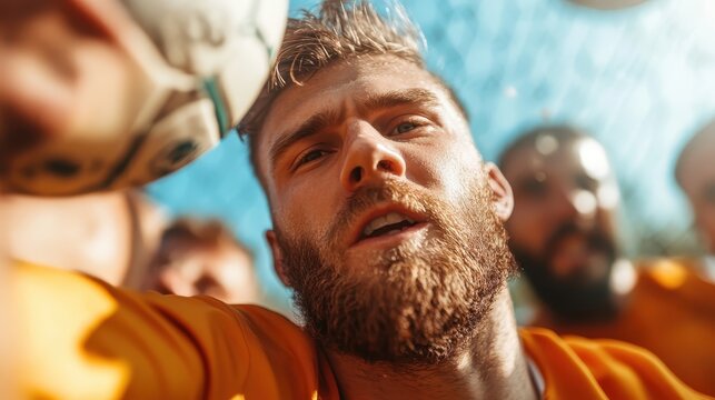A group of basketball players celebrating a victory, showing joy and teamwork, surrounded by teammates under clear skies on an outdoor court after scoring a winning goal.