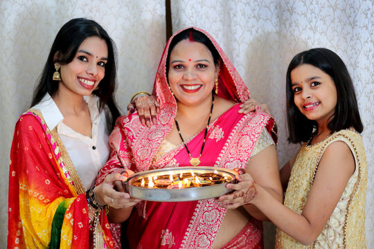 A joyful family moment, sharing the warmth and light of Diwali together. A heartwarming family gathering, lighting up the festival of joy.