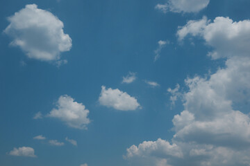 The beautiful blue sky and white clouds in the background of the sky copy the horizontal shape of the space