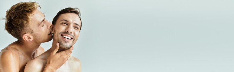 A joyful young couple enjoys a playful and intimate moment, radiating love and connection.