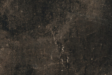 The background is made of an old worn, gray-black surface
