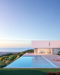 Fototapeta premium Modern hillside villa with infinity pool overlooking the ocean at sunset