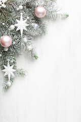 Christmas and New Year background..Fir branch with Christmas decorations old wooden shabby background with empty space for text.