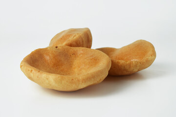 Closeup photo of three opak crackers or sticky rice crackers