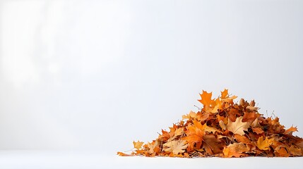 Pile of vibrant autumn leaves on a neutral background