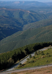 Asphalt road leading through a hilly landscape in Bulgaria 