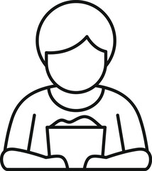 Young boy enjoying popcorn from bucket, watching a movie in cinema