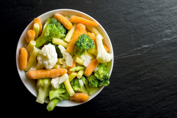 Frozen vegetables in white bowl