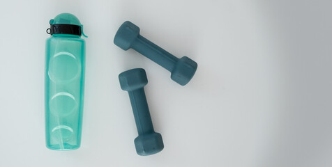 fitness equipment, kettlebells and a drinking bottle on a white background