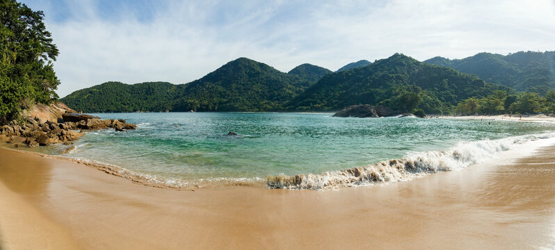 Beautiful beach in Trindade city of Paraty, state of Rio de Janeiro, paradise beach with tropical green water in Brazil