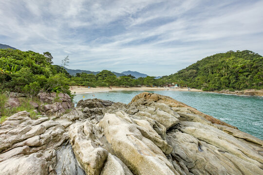 Beautiful beach in Trindade city of Paraty, state of Rio de Janeiro, paradise beach with tropical green water in Brazil
