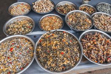Fresh edible snails at a local market in Nha Trang, Vietnam.