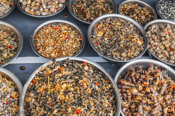 Fresh edible snails at a local market in Nha Trang, Vietnam.