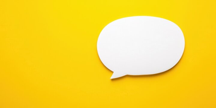 White speech bubble on vibrant yellow background, ideal for communication and creative designs.