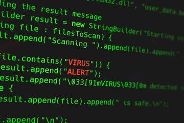 Obraz premium Green code line with Virus Alert words on screen. Security online concept